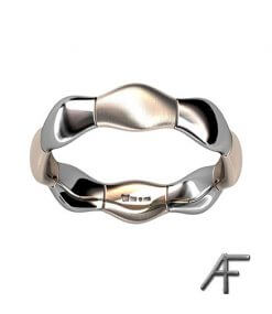 designad vigselring i rött och vitt guld